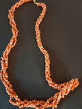 Pink and salmon three strand twisted necklace