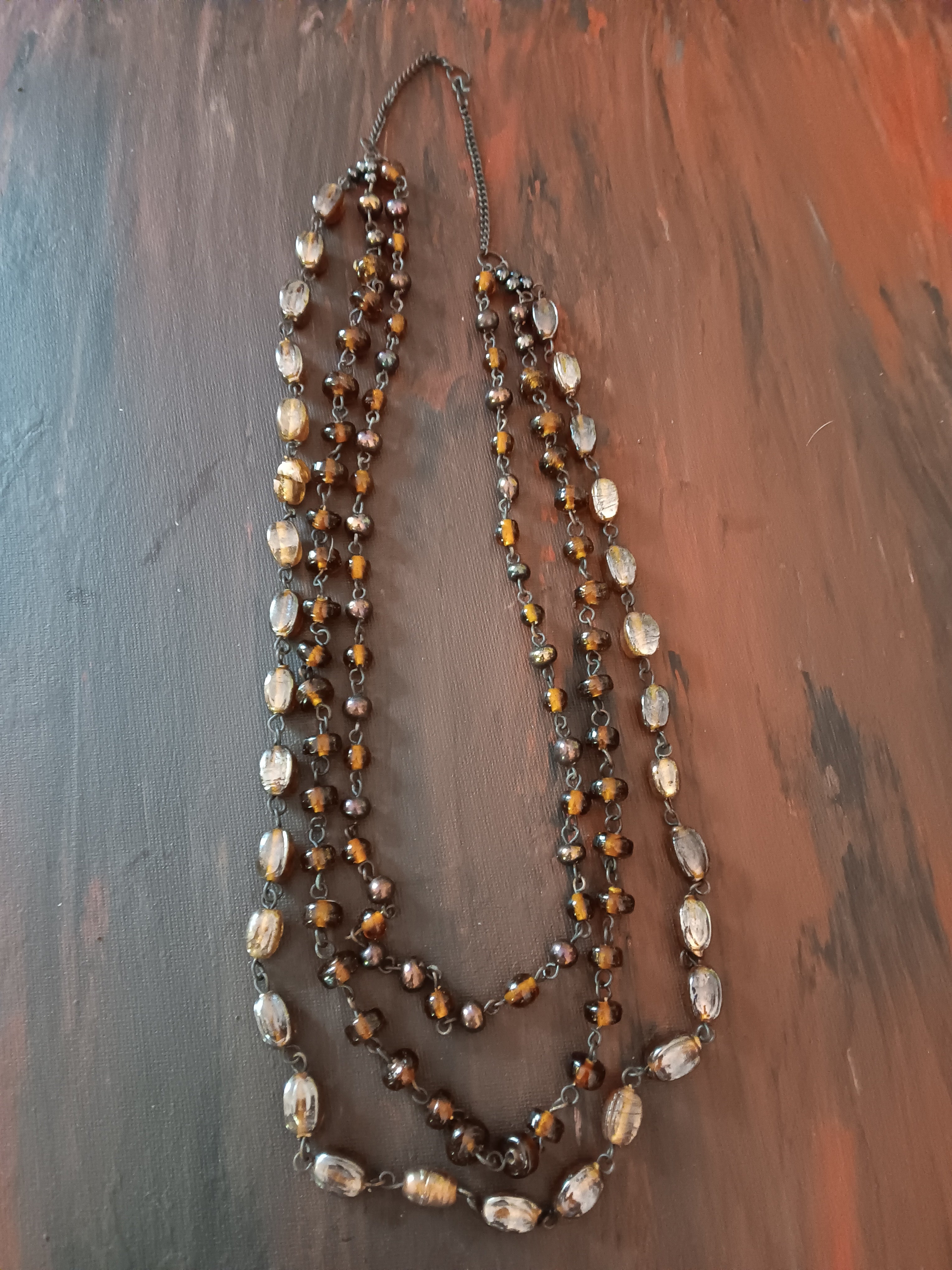 Vintage necklace triple strand amber and briwn beads lucite 24" neck opening