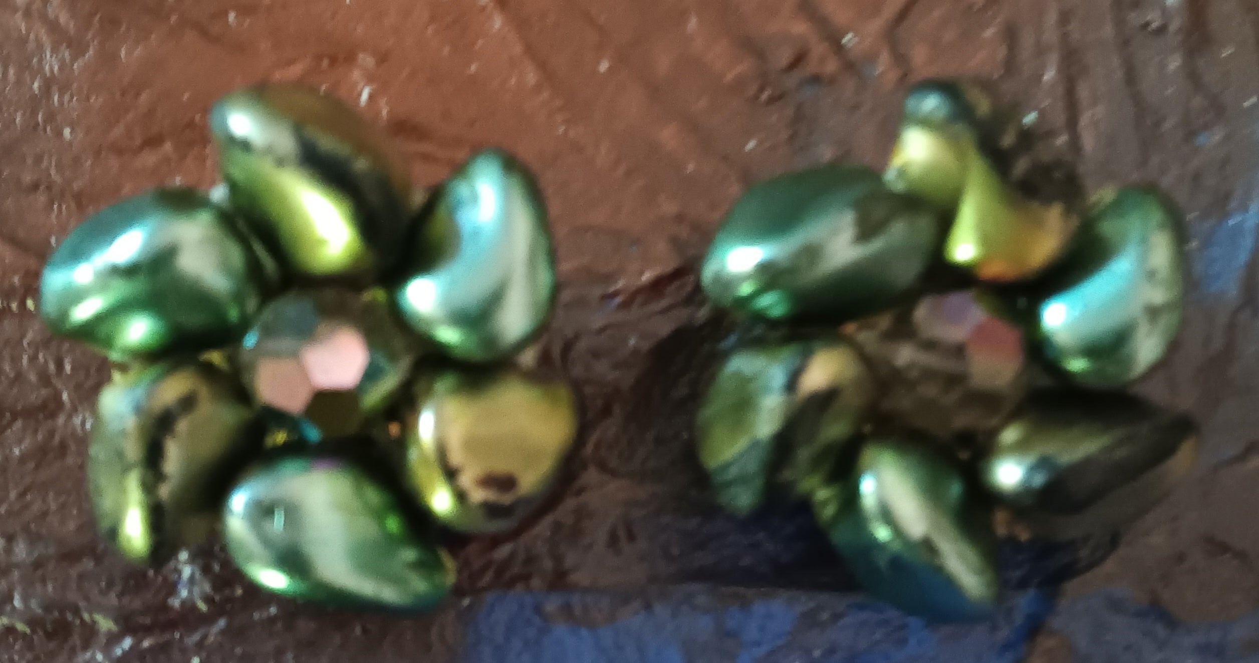 Vintage clip on earrings marked Austria blue green with iridescent pink rhinestone