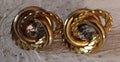 Vintage possible Trafari gold tone twisted earrings with large white rhinestone center post back