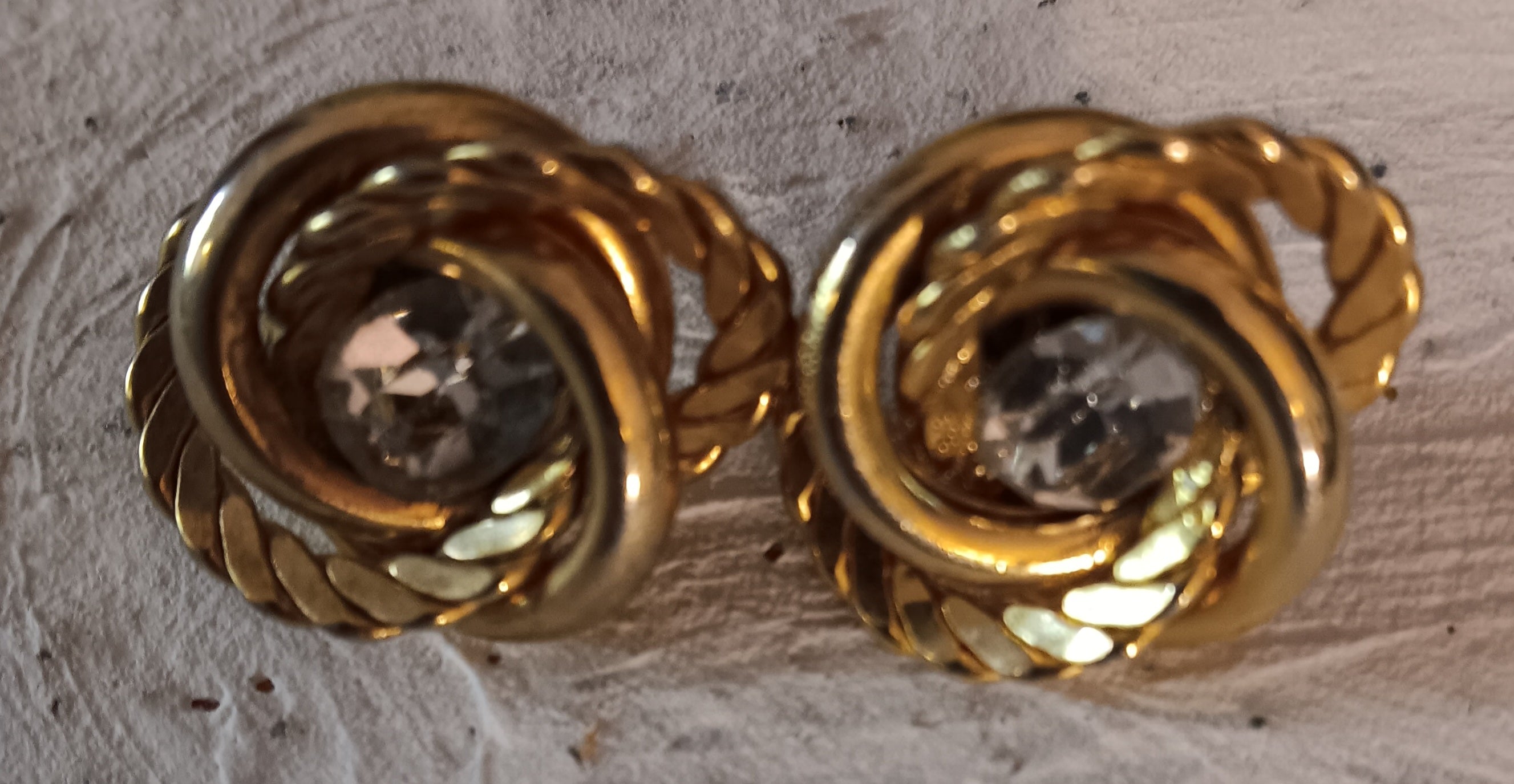 Vintage possible Trafari gold tone twisted earrings with large white rhinestone center post back